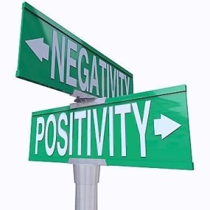 Green Signs Pointing to Positive and Negative energy demostrating Polarity